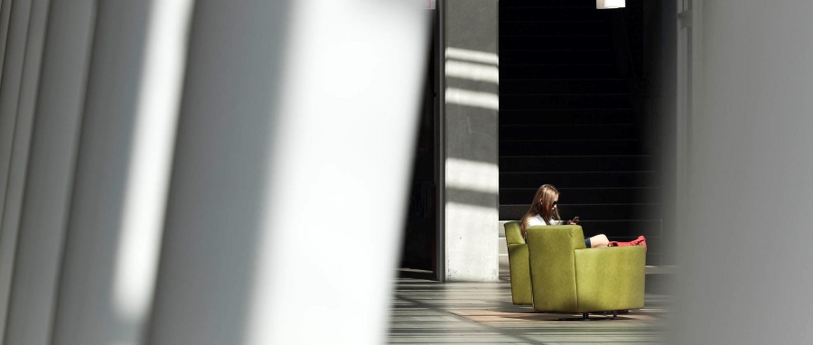 A woman sitting on a green couch